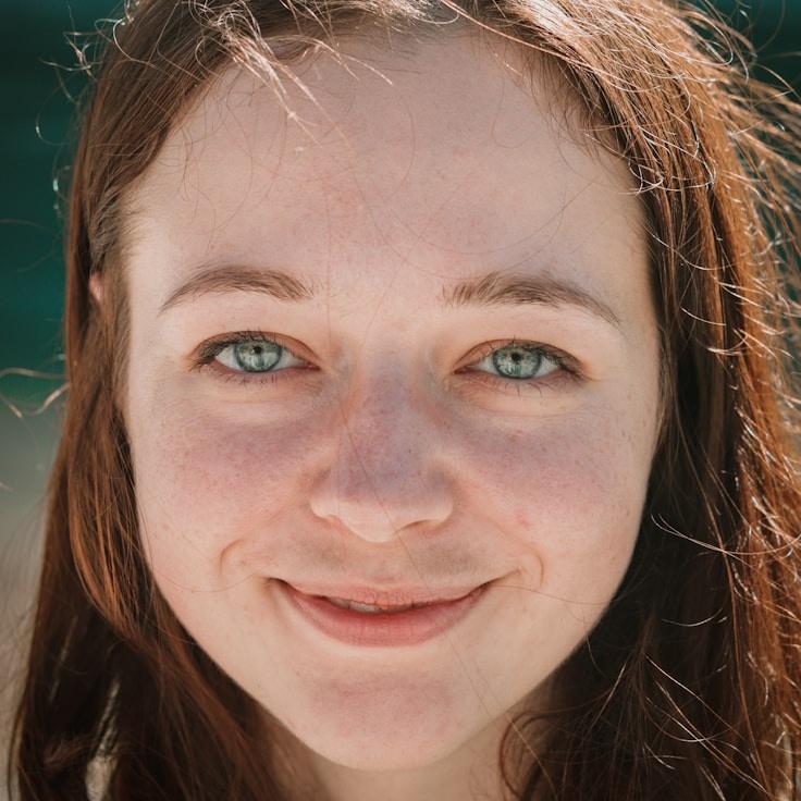 Lina Sharma, Lead Design Curator at SeaGrassMistVale, reviewing corporate floral arrangements